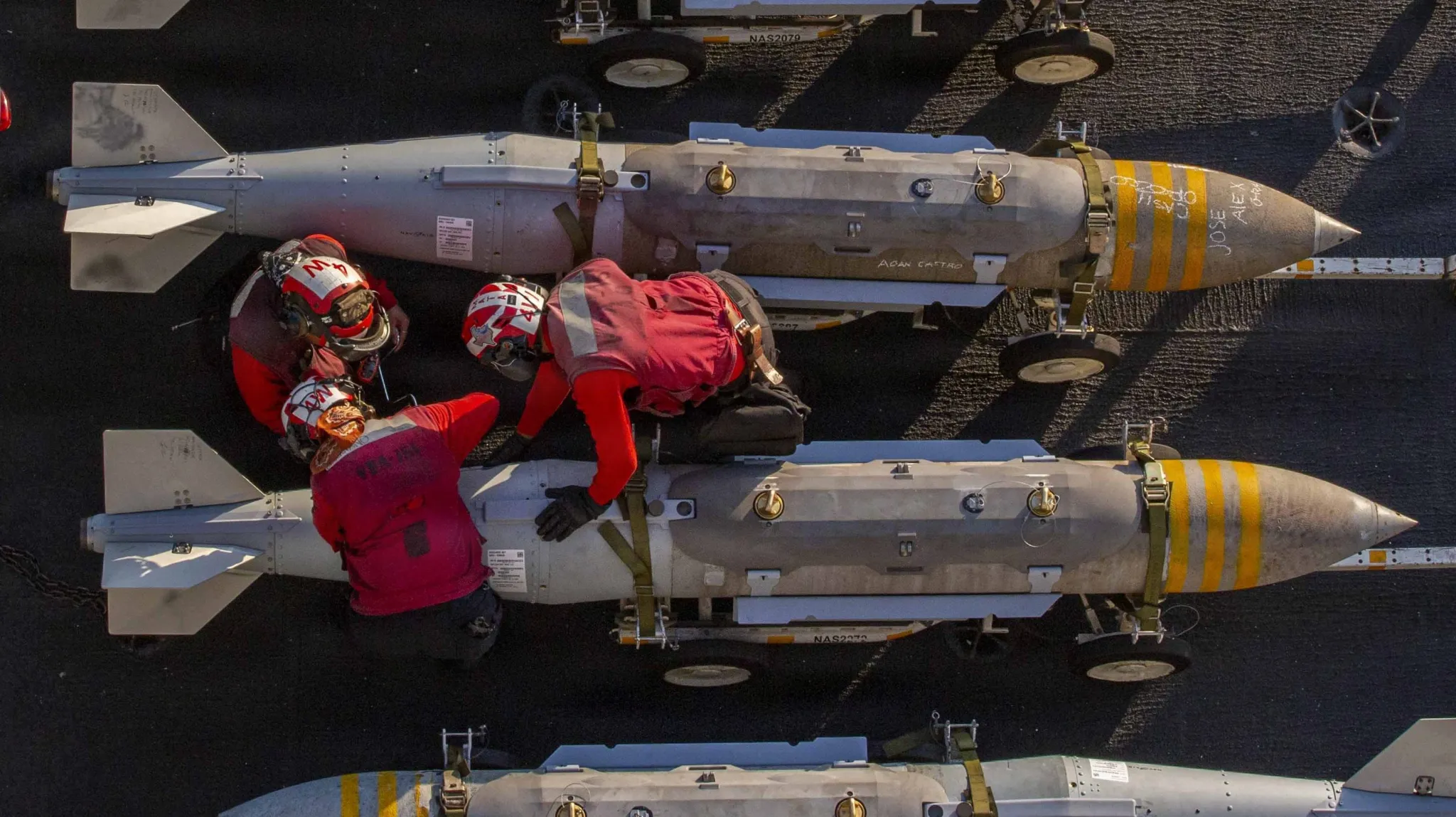 Names on Bombs Aboard Lincoln Sign Bold Tradition as Readiness Rises